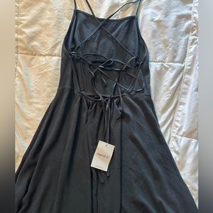 Never worn super cute little black dress with an open back.